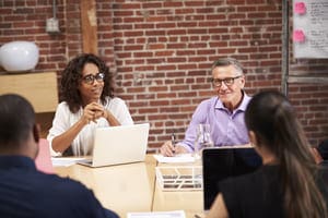 businesswoman leading office meeting of colleagues 2023 11 27 04 50 46 utc 1