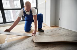 man installing laminate timber floor in apartment 2023 11 27 05 08 51 utc 2